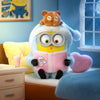 A fluffy blue vinyl plush keychain featuring a bear head and a pink book, set with a small yellow cushion.