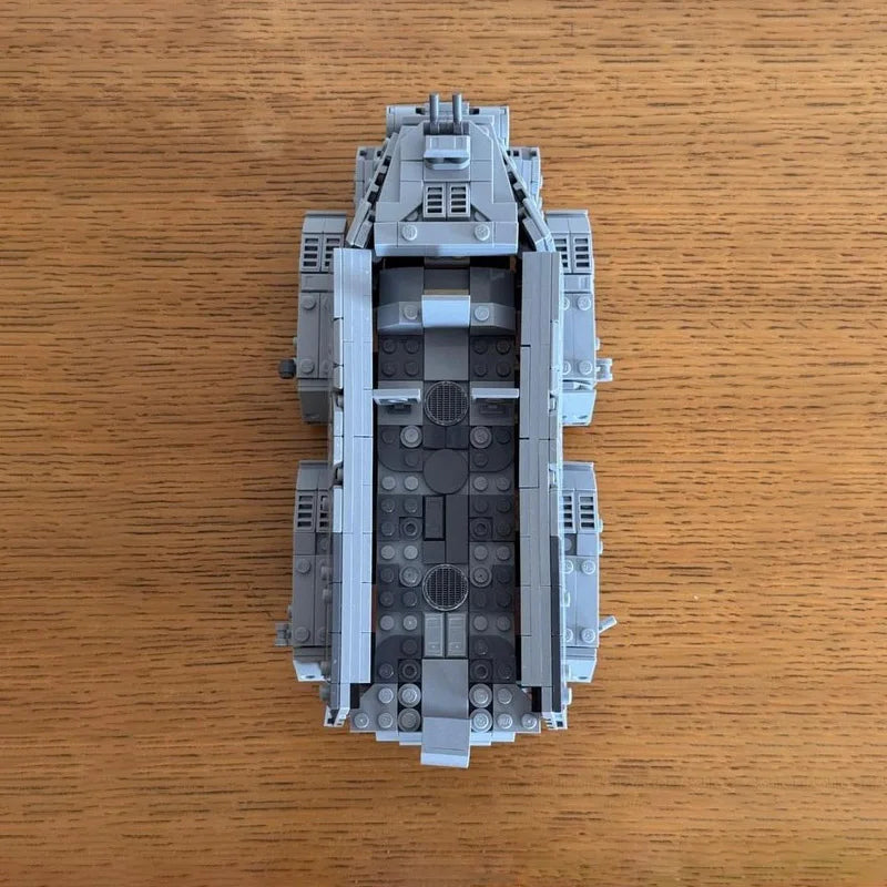 A gray LEGO model of an Imperial Troop Transport building, featuring detailed paneling and structural elements.