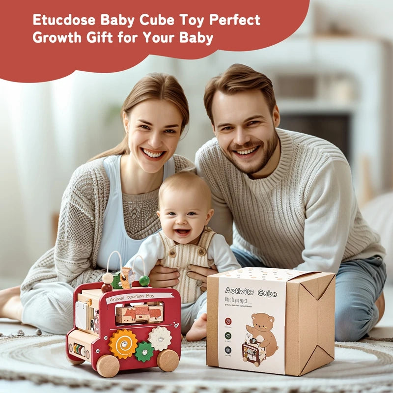A mother and father are shown with a baby and a wooden toy cube for a growth gift.