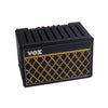 Black guitar pick holder with a speaker-shaped design featuring a gold mesh pattern.