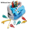 A blue plastic shark toy with various colored teeth and accessories is shown without its box.
