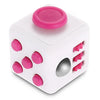 A white fidget cube with a pink rotating joystick and magnetic buttons.