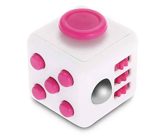 A white fidget cube with a pink rotating joystick and magnetic buttons.
