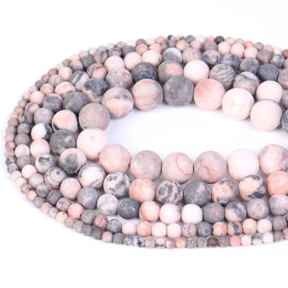 A strand of natural sea sediment jasper and turquoise beads for jewelry making