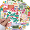A hand holds a colorful sticker pack featuring positive affirmation phrases like I am, work hard, and stay happy.