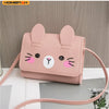 A pink cat-shaped mini PU leather crossbody handbag with long ears and a pink strap.