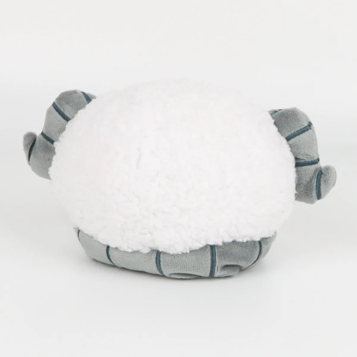 A white sheep plush doll with gray fabric accents, resembling a soft cuddle pillow.