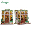 A detailed 3D wooden book nook kit featuring an antique-style shop facade with glass doors and greenery.