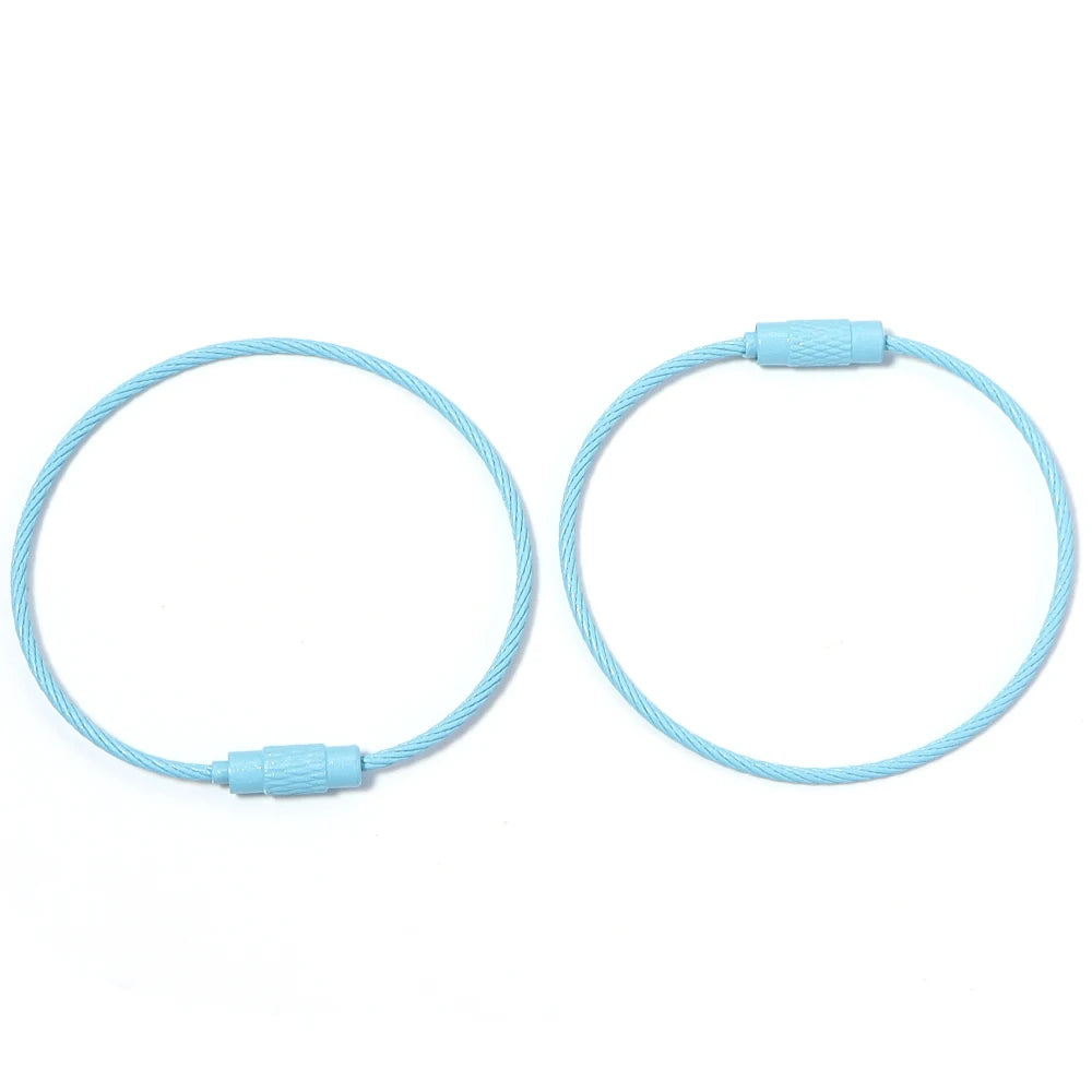 A pair of light blue stainless steel wire keychain rings with screw locks.