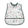 A white baby bib with a dark green trim featuring a watercolor cartoon pattern of various leaves and flowers.