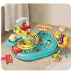 A yellow and red interactive kids kitchen sink toy with running water and fishing game in a blue plastic tub.
