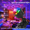 A black USB powered ambient light with a rotating head and colorful LED ball illuminating a room.