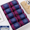 A box of YEDAN MERIN purple worsted wool thread yarn for knitting projects