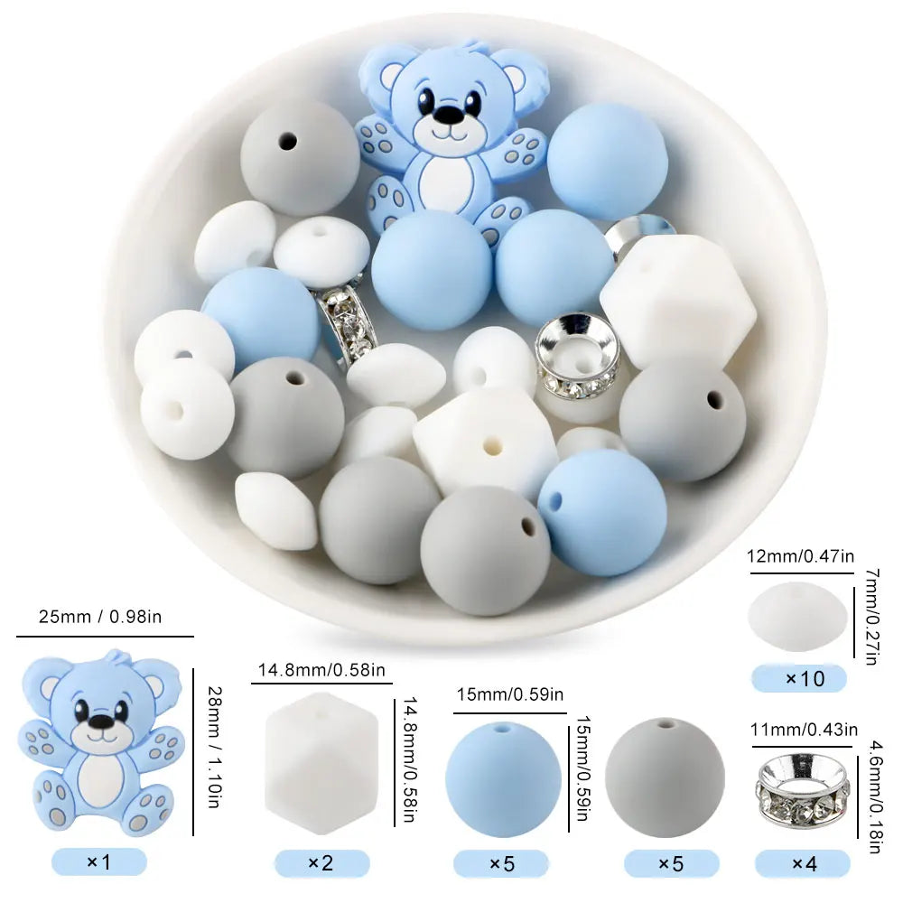 A white bowl filled with various blue and white silicone beads shaped like cartoon animals for DIY jewelry making