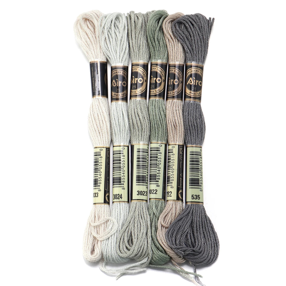 A set of six skeins of vibrant embroidery thread in various shades of gray and green for cross stitch and DIY crafts