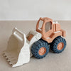 A plastic kids sand and water play set featuring a pull-along bulldozer trolley in orange and gray colors.
