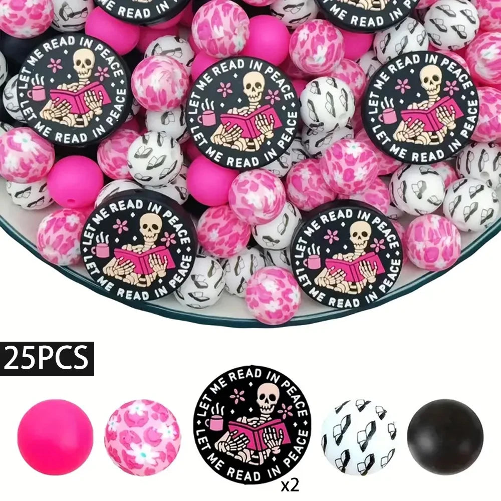 A set of 25 silicone beads featuring a Halloween theme with skulls and books in black and pink colors.