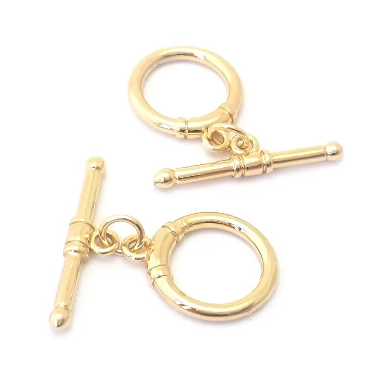 A pair of 18K gold round O-toggle clasps for bracelets and jewelry making.