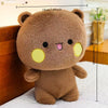 A brown fluffy panda plush toy with yellow accents, shown against a white background.
