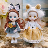 Two craft dolls with glitter eyes and various hair colors and outfits
