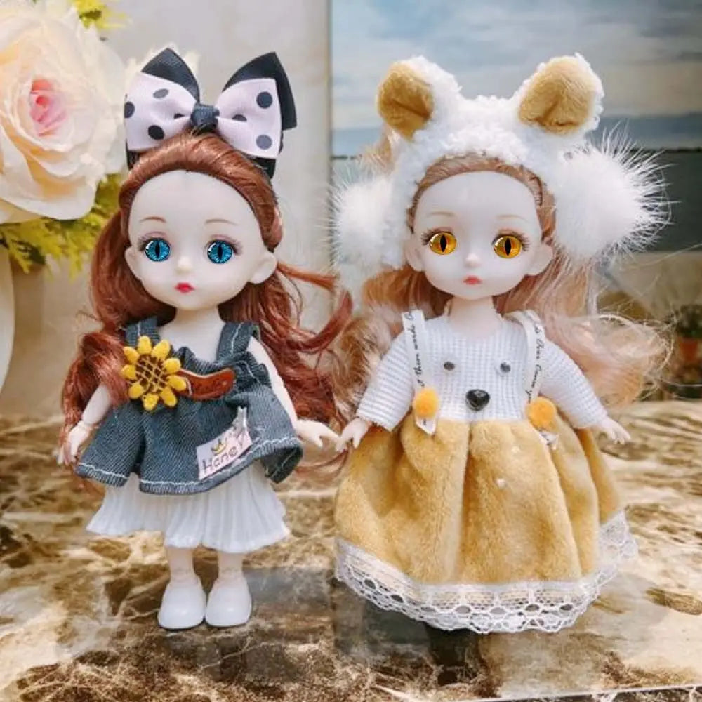 Two craft dolls with glitter eyes and various hair colors and outfits