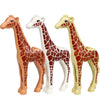 A set of six plastic building blocks shaped like giraffes in various colors and styles.