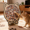 A tabby cat pawing at a wooden cat-shaped jigsaw puzzle featuring many small cats.