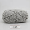 A ball of light gray pre-dyed milk cotton yarn, 50g, used for knitting and crochet.