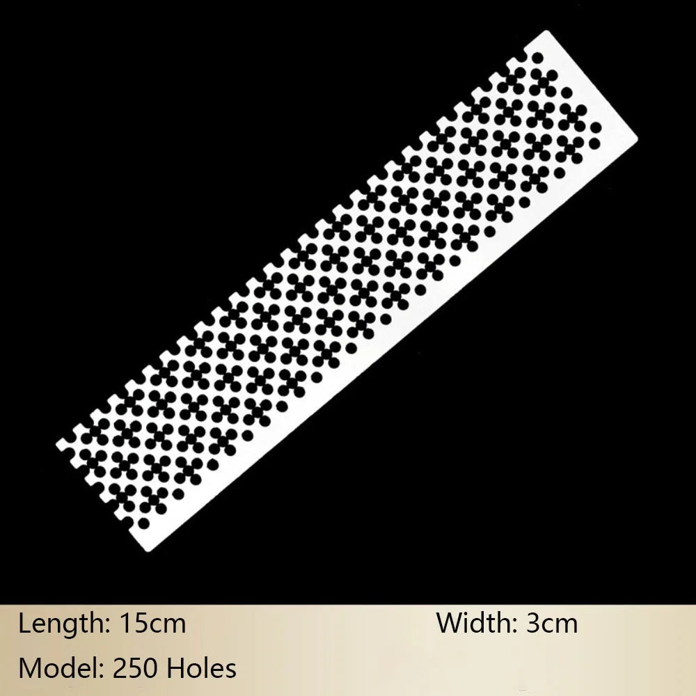 A rectangular stainless steel ruler with 250 holes used for diamond painting.