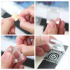 Hands hold and place a clear light pad switch protector cover onto a device.