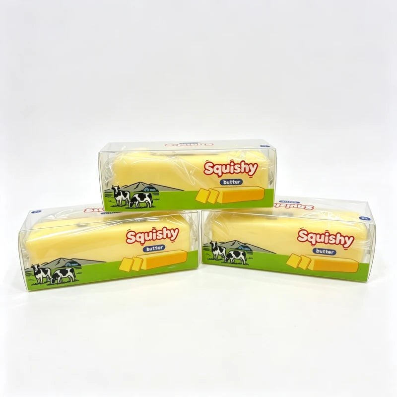 A set of yellow Squishy butter fidget balls packaged in clear plastic containers.