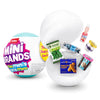 A collection of Mini Brands collectible toys, including a white ball and various packaged items.