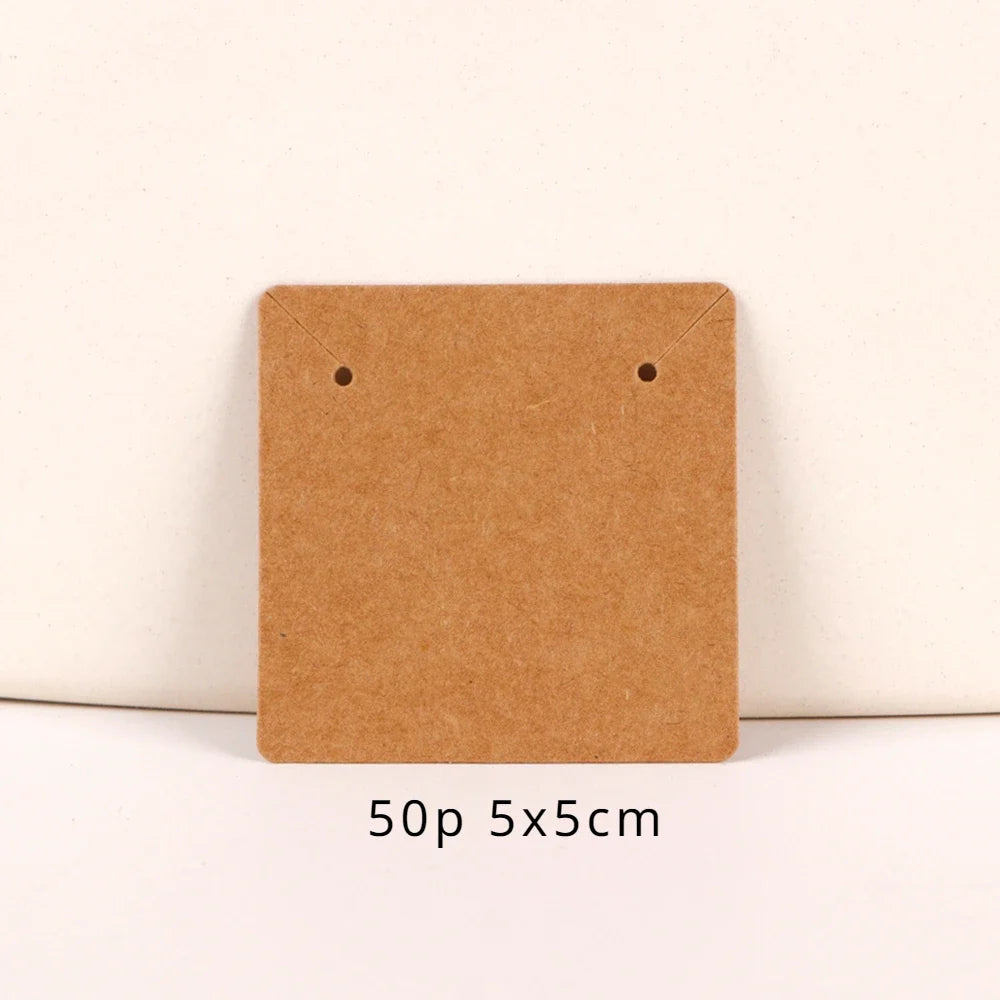 A square brown kraft paper card used for jewelry display, measuring 5x5 cm.