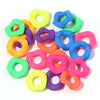 Assortment of colorful acrylic spacer beads in various shades including green, yellow, purple, and blue.