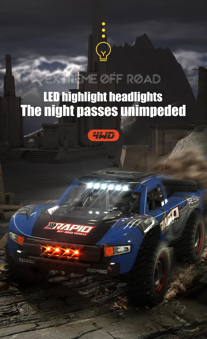 A blue off-road monster truck driving through a dusty environment with bright LED headlights.