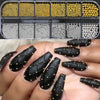 A collection of gold caviar beads in various sizes and colors displayed in a clear plastic container for nail art