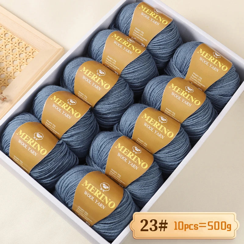 Box of Merino wool yarn balls with labels indicating Merino wool yarn 10 pieces totaling 500g