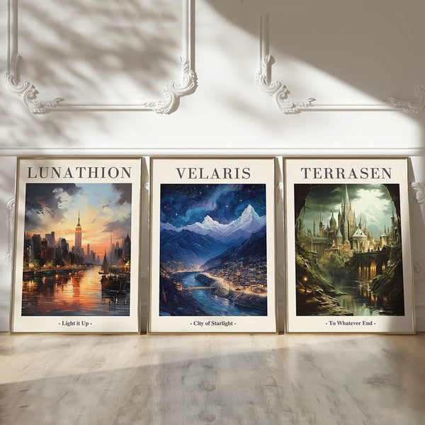 Three framed landscape prints titled Lunathion Velaris and Terrasen featuring fantasy cityscapes and nature scenes