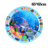 A round blue inflatable sensory play mat featuring colorful fish and sea creatures.
