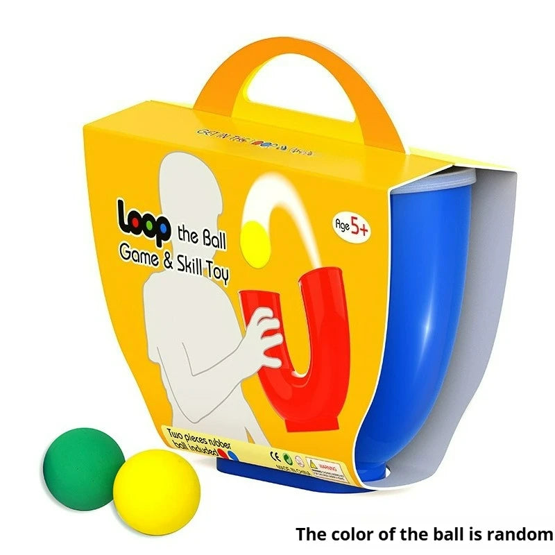 An orange box for a U-shaped juggling ball skill toy with green and yellow balls.