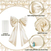 A cream satin bow decoration with a ribbon and tags, shown alongside its components and finished product.