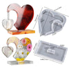 A heart-shaped silicone mold and frame for casting resin, shown with various sizes and a finished product.