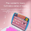A pink and blue interactive learning laptop toy with a keyboard and musical notes is shown.