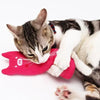 A tabby cat is interacting with a bright pink catnip plush toy.