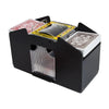 A black automatic card shuffler device with a clear dispenser tray and a stack of playing cards.