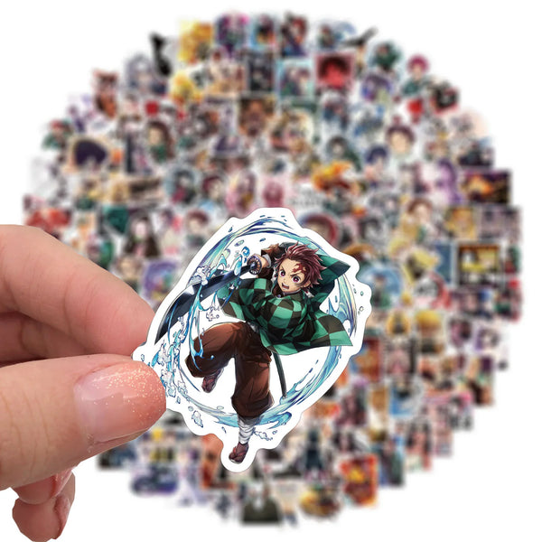A hand holds an anime demon slayer themed decal featuring a character with purple hair and green clothing against a light blu