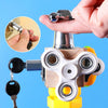 A hand holds a silver key attached to a wooden busy cube toy used for early education and hand eye coordination.