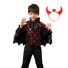 A child wearing a black vampire bat costume set with a cape and red bat-ear accessories.