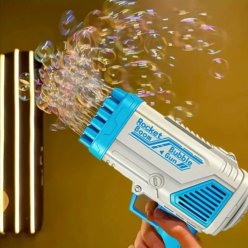 A hand holds a white and blue rocket boom bubble gun spraying bubbles against a yellow background.