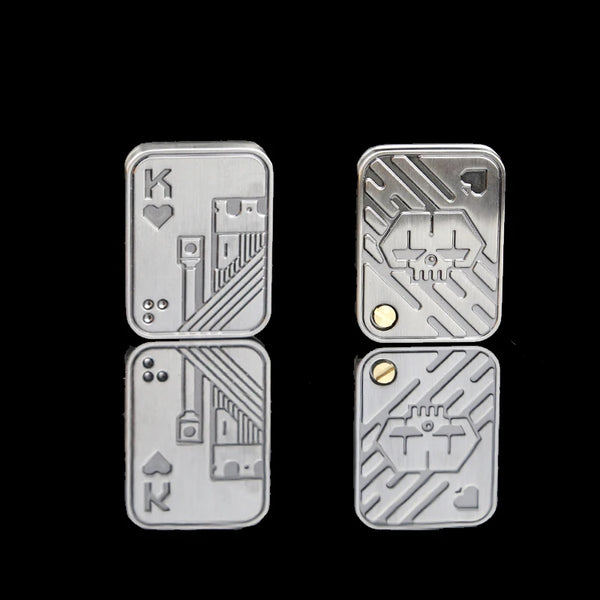 Silver metal fidget spinner toys shaped like playing cards, featuring King and heart symbols.